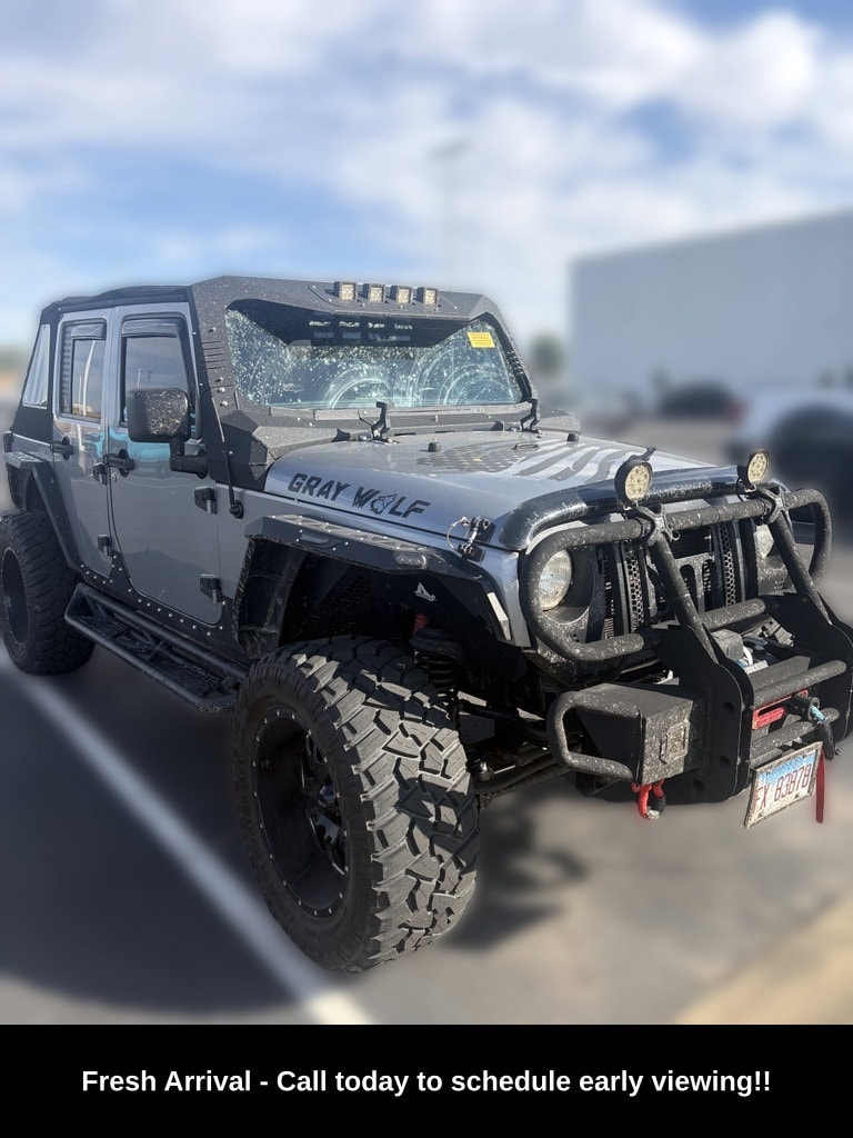 Used 2014 Jeep Wrangler Unlimited Sport with VIN 1C4BJWDG2EL216907 for sale in Urbana, IL