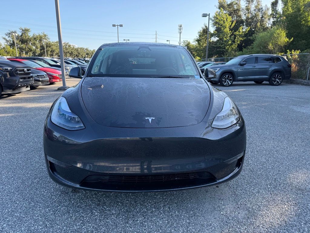 Used 2024 Tesla Model Y Long Range with VIN 7SAYGAEE2RF101518 for sale in Orlando, FL