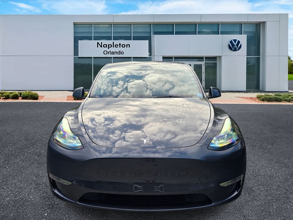 Used 2025 Tesla Model Y Long Range with VIN 7SAYGDEE0SA345446 for sale in Orlando, FL