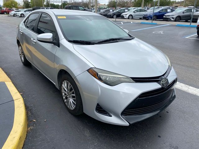Used 2018 Toyota Corolla LE with VIN 5YFBURHE0JP825433 for sale in Kissimmee, FL