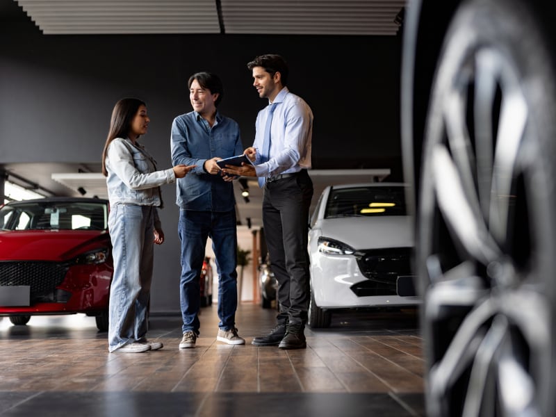 Napoli Kia Salesperson helping their customers