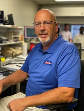 Staff member Kevin Burdette from 4c51a2325048