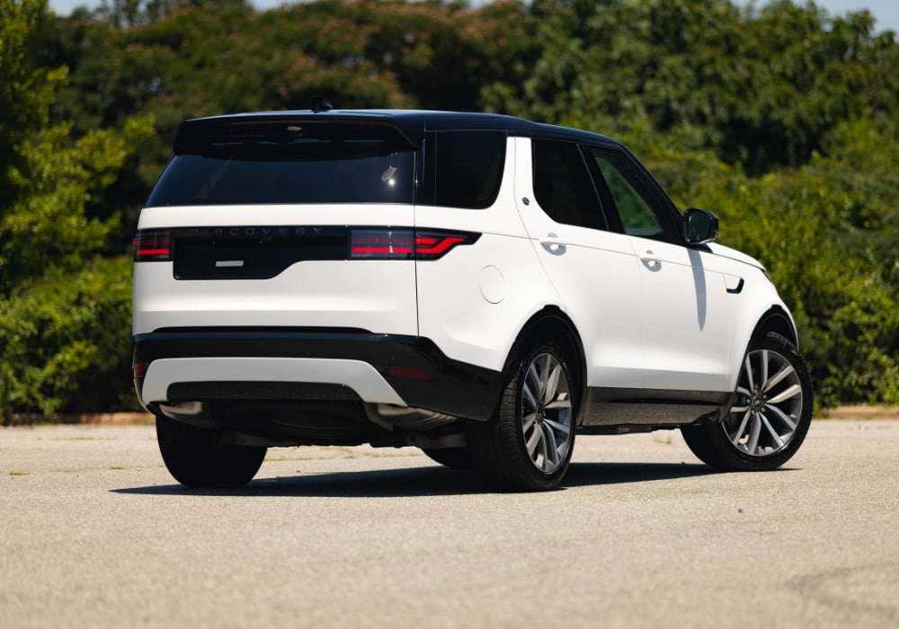 discovery-for-sale-greensboro-nc.png Rear exterior view of the new Land Rover Discovery for sale in Greensboro. The SUV is white with black detailing