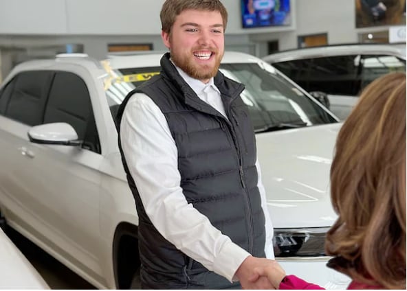 John Vogel Finance Manage Assisting a Customer