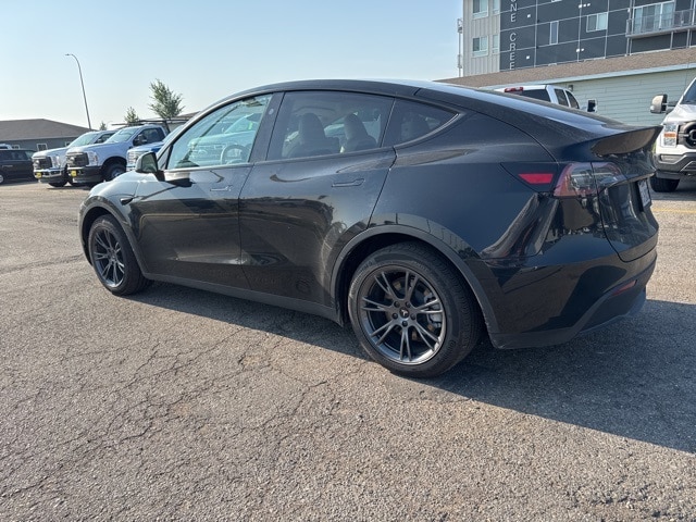 Used 2025 Tesla Model Y Long Range with VIN 7SAYGDEE6SF296501 for sale in Grand Forks, ND
