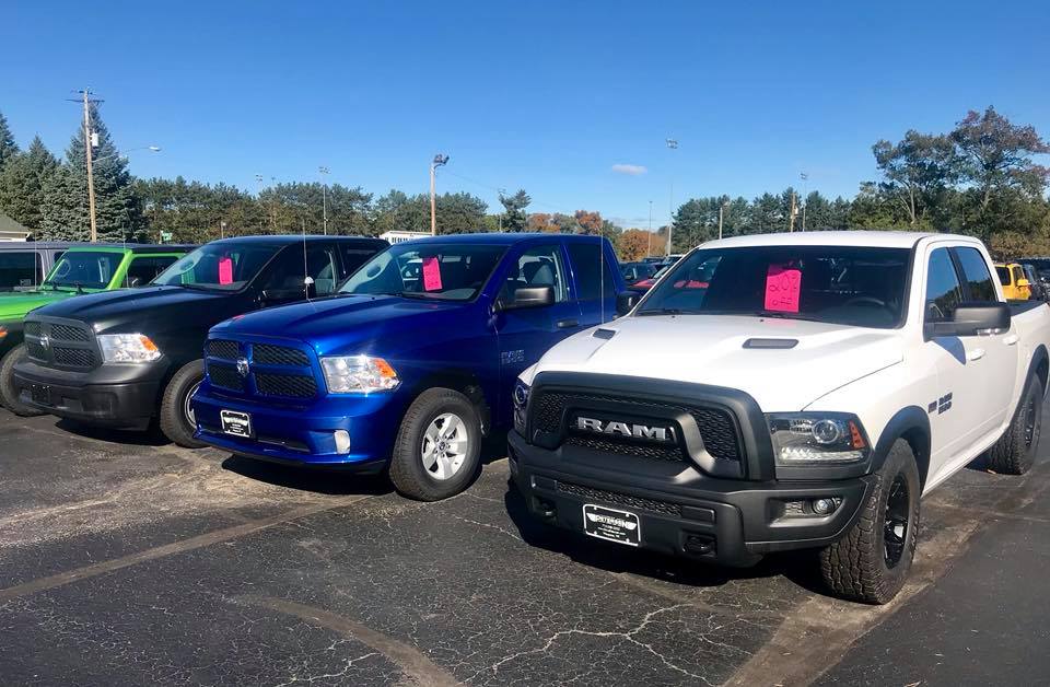 Ram trucks lineup in the Petersen CDJR parking lot