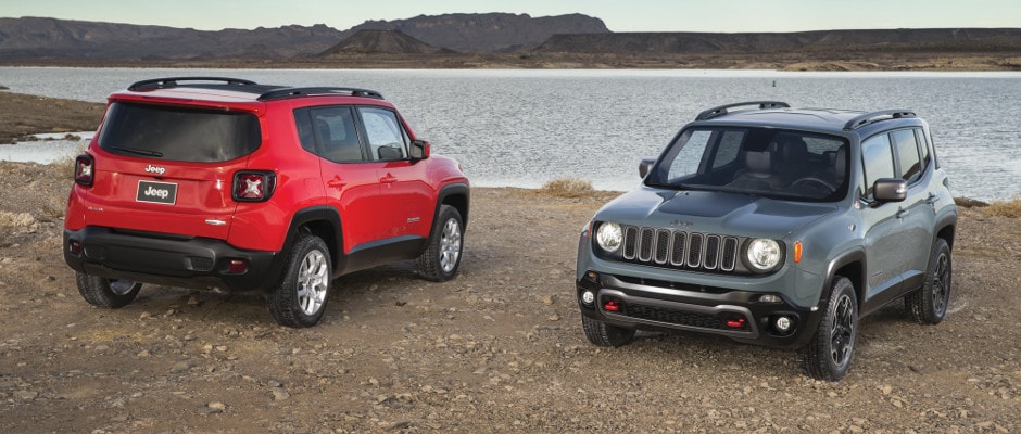 Two Jeep Renegades parked at the beach