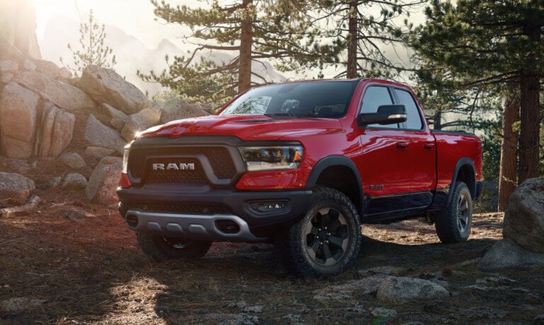 2020 Ram 1500 in red parking in a forest