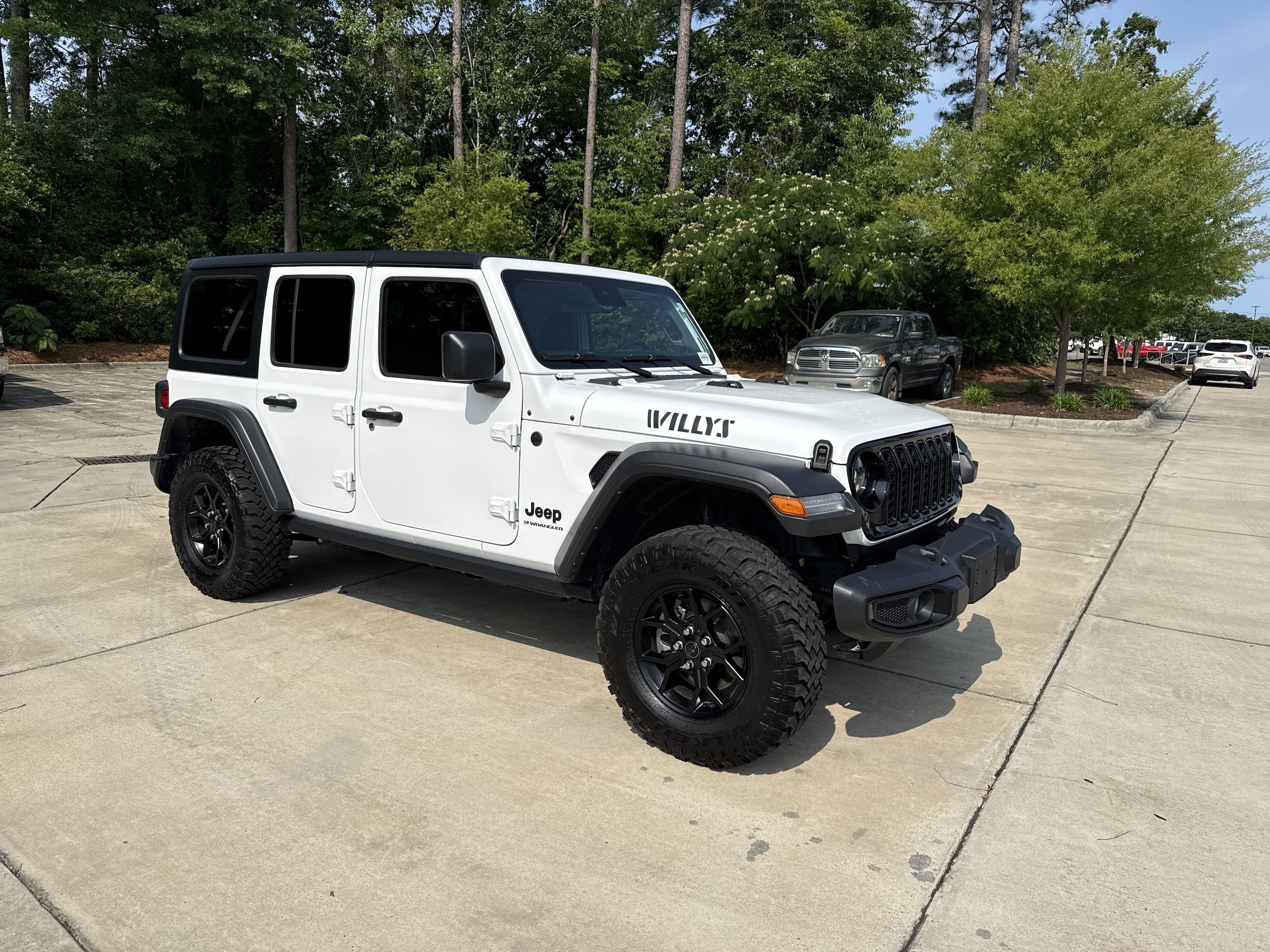 Used 2024 Jeep Wrangler 4-Door Willys with VIN 1C4PJXDG4RW289079 for sale in Wilmington, NC
