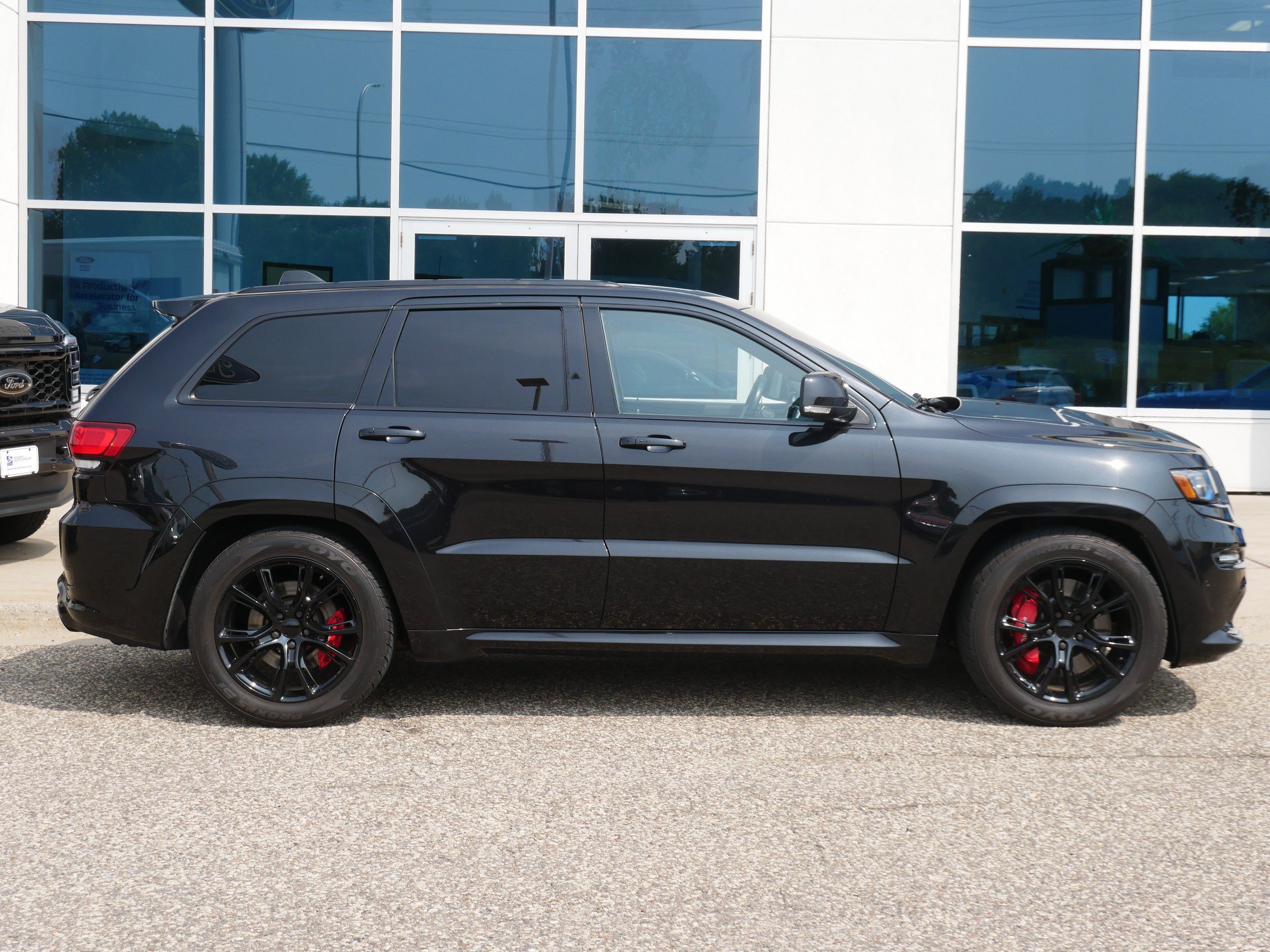 Used 2015 Jeep Grand Cherokee SRT with VIN 1C4RJFDJ1FC806916 for sale in New Brighton, Minnesota