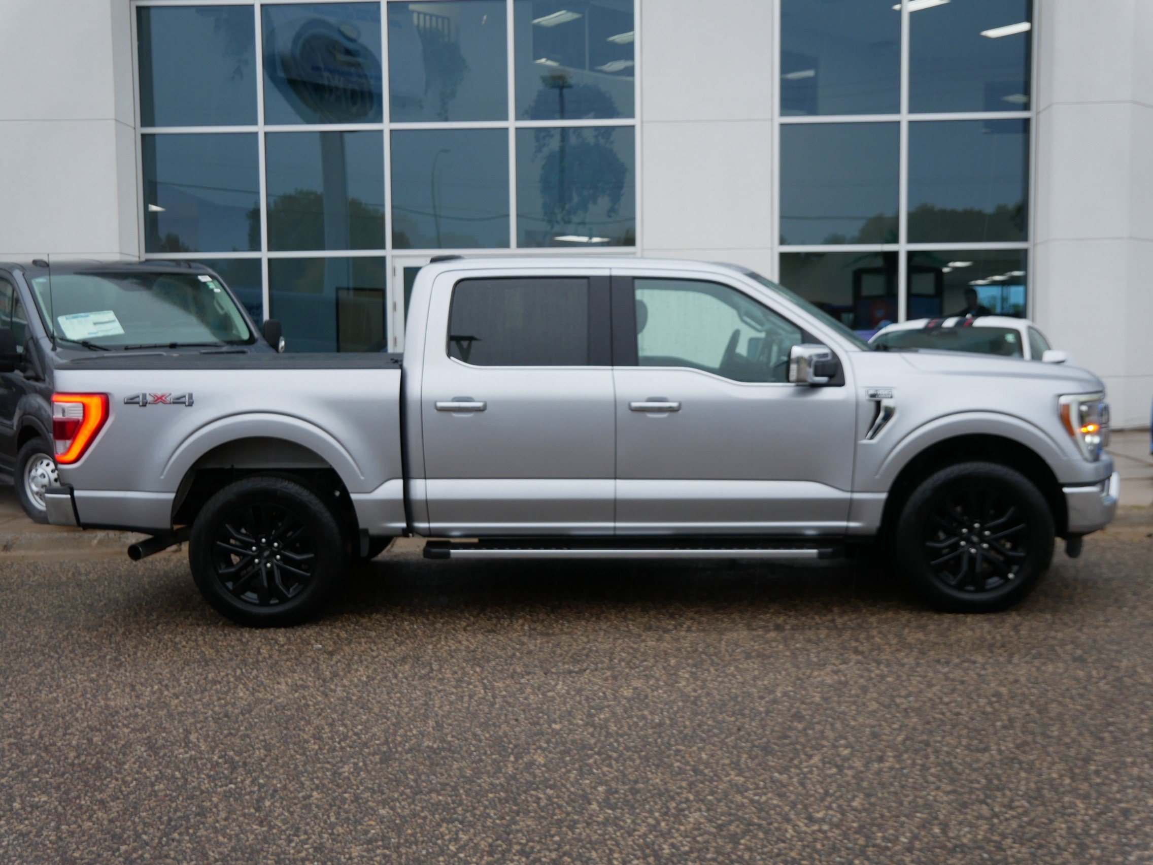 Used 2021 Ford F-150 Lariat with VIN 1FTFW1E88MFA85802 for sale in New Brighton, Minnesota