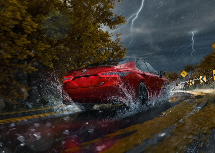 Toyota Camry driving through rain
