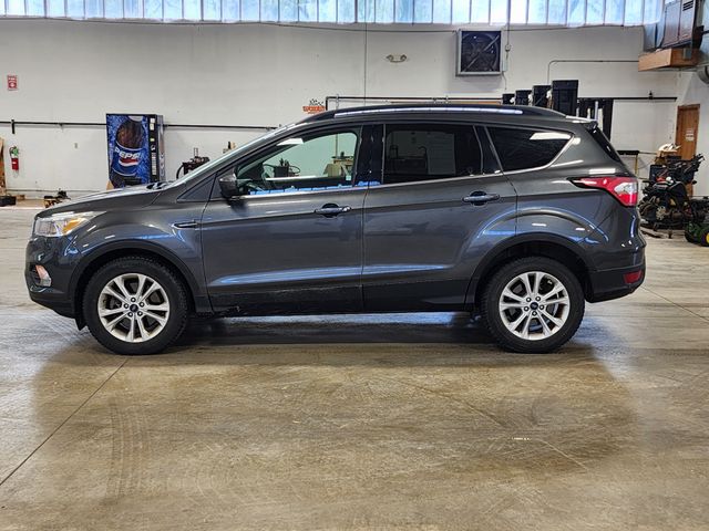 Used 2018 Ford Escape SE with VIN 1FMCU9GD8JUC01052 for sale in Clinton, MI