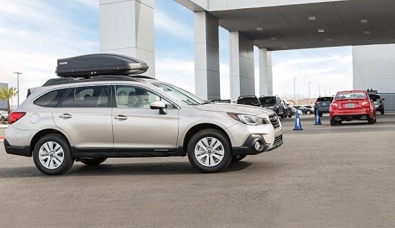 Subaru being driven off the lot