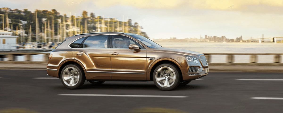 Bentley Bentayga driving in Newport Beach