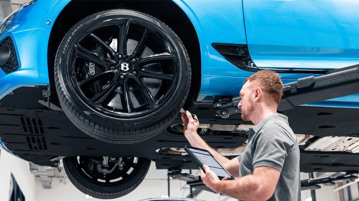 Technician working on a Bentley vehicle
