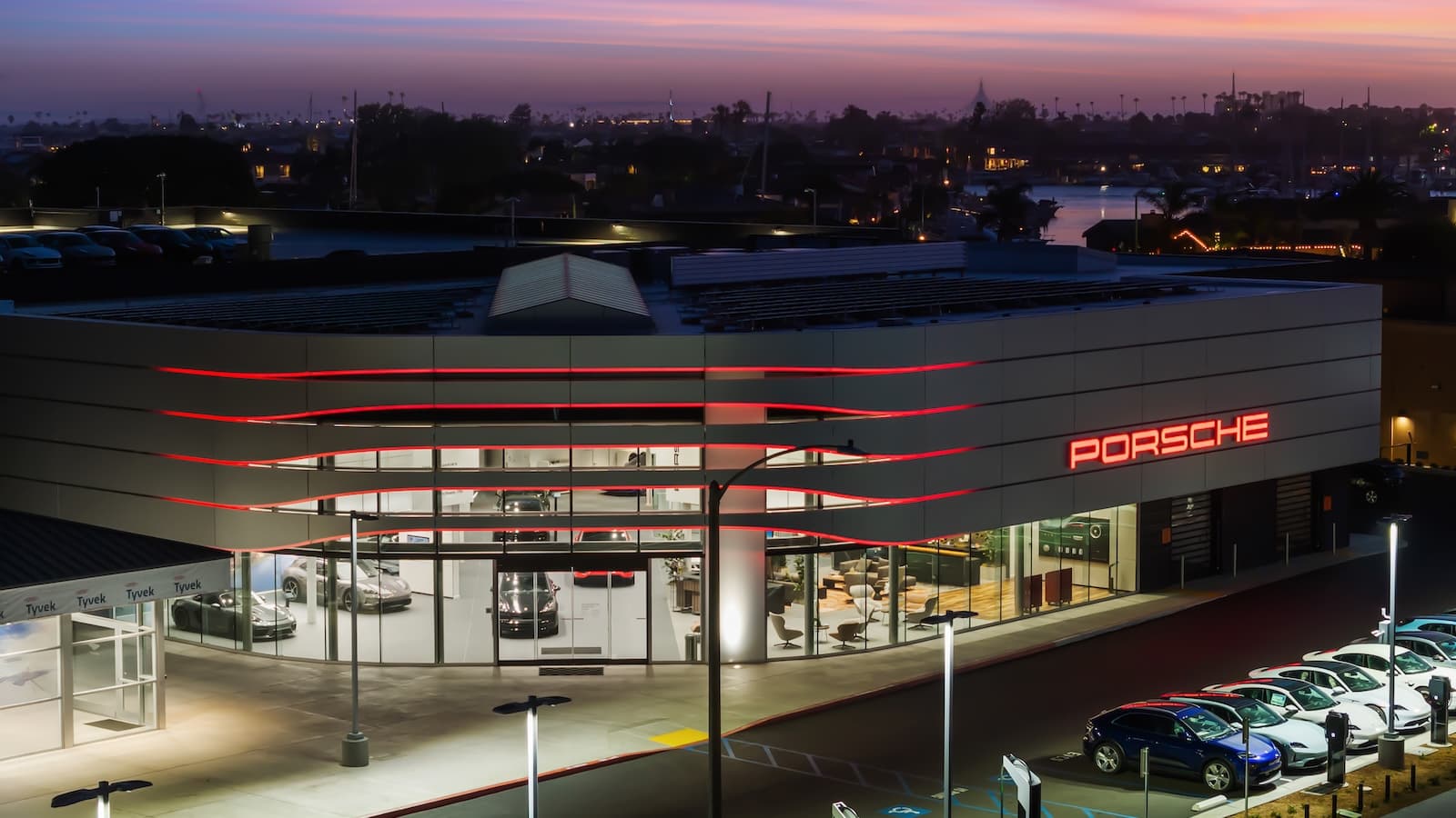 Exterior view of Porsche Newport Beach in the evening