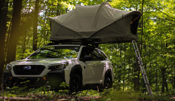 Subaru with open Tent on the roof