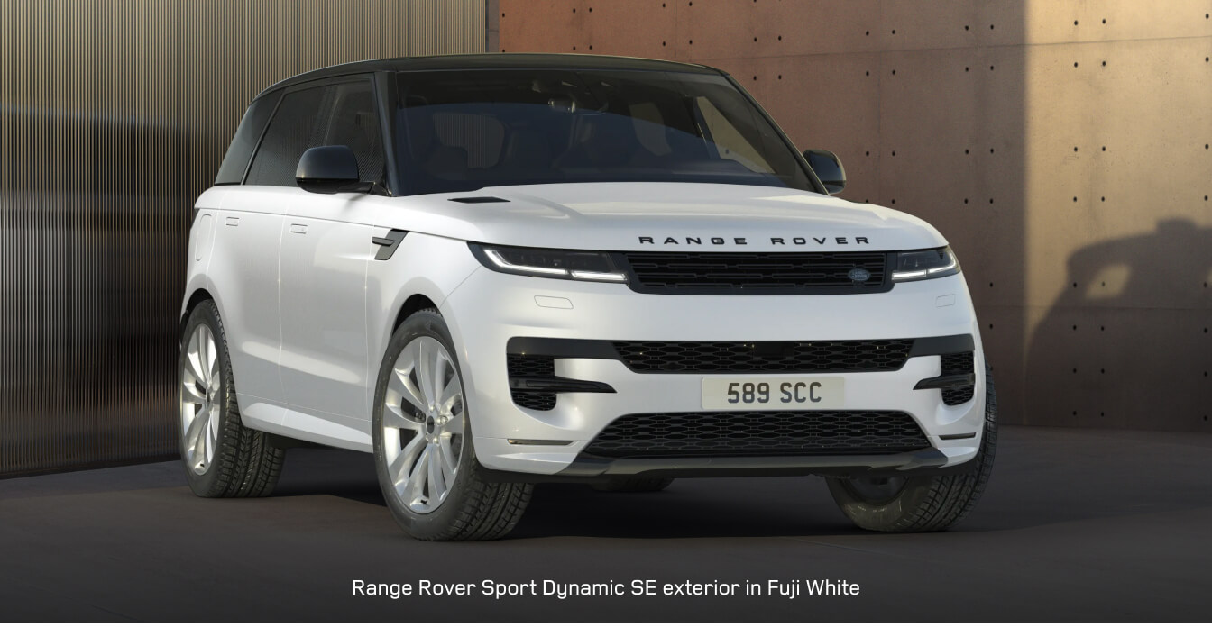 2025 Range Rover Sport idles in front of a modern architectural structure.