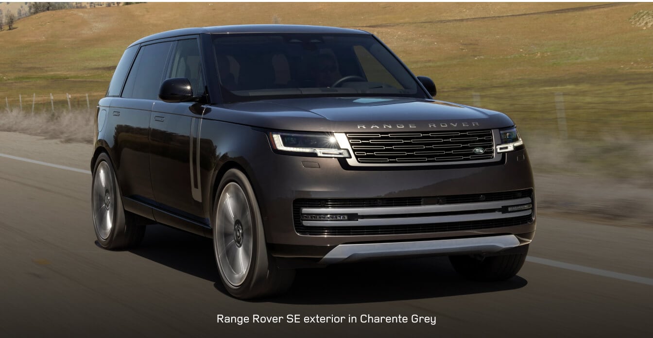 2025 Range Rover SE drives along a scenic highway.