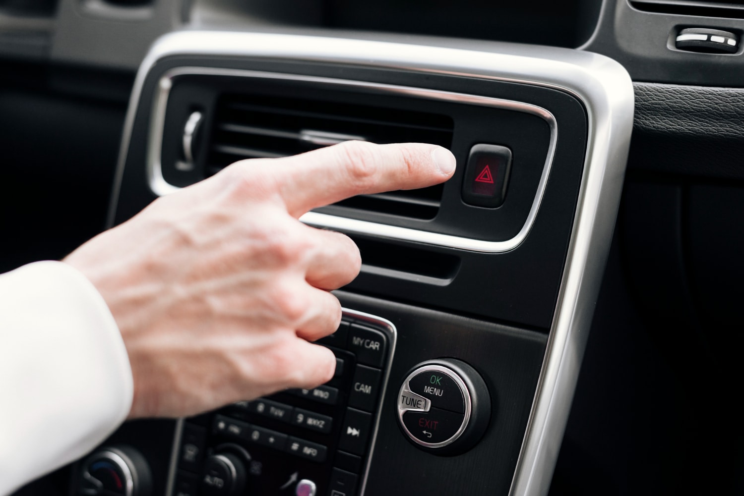 Hand reaching out to A/C vent
