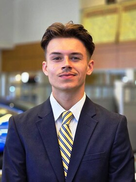 Staff member CAMERON NEWTON from ID_0bf100600855