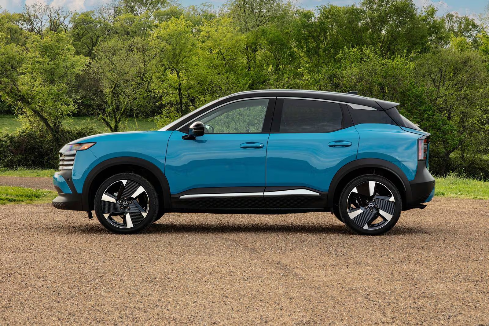 The new 2026 Nissan Kicks parked outside on a gravel road