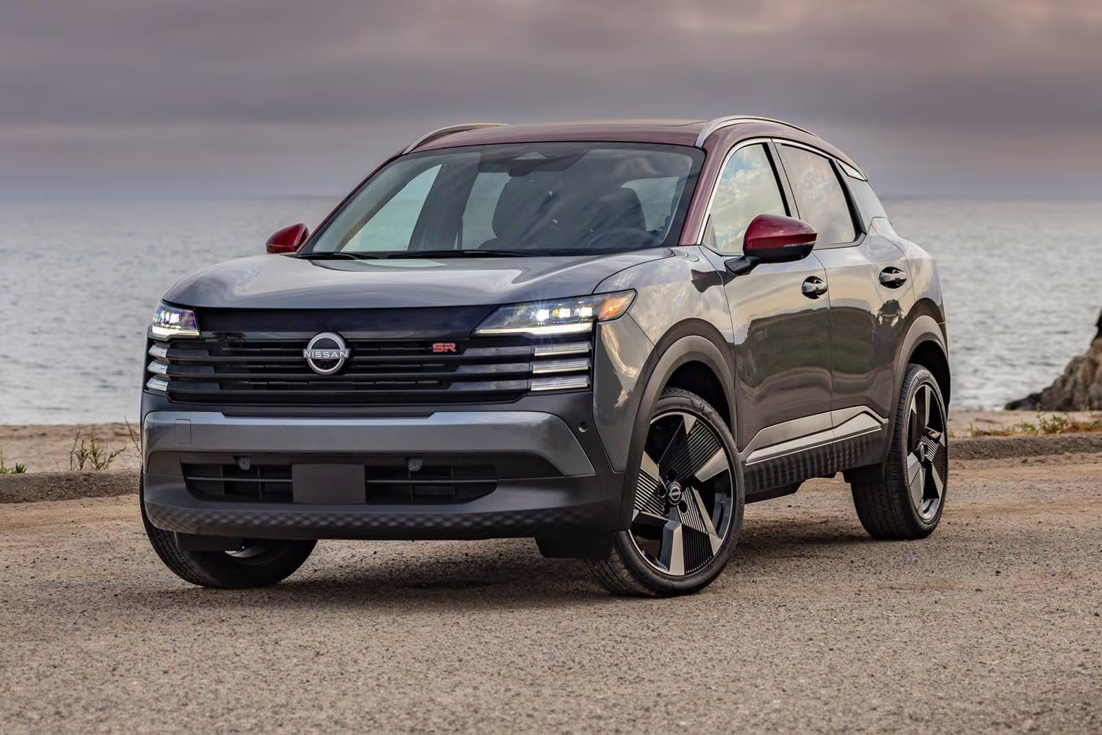 The new 2026 Nissan Kicks parked outside with the view of a body of water in the back ground