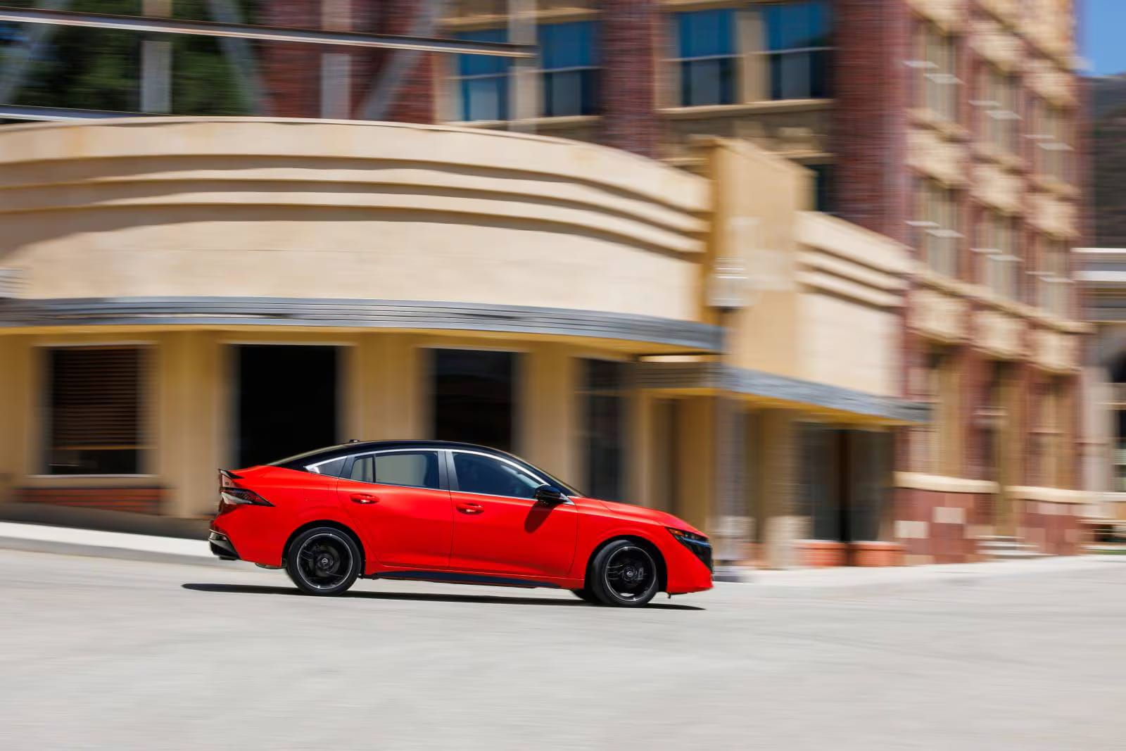 The new 2026 Nissan Sentra driving through the streets in a city