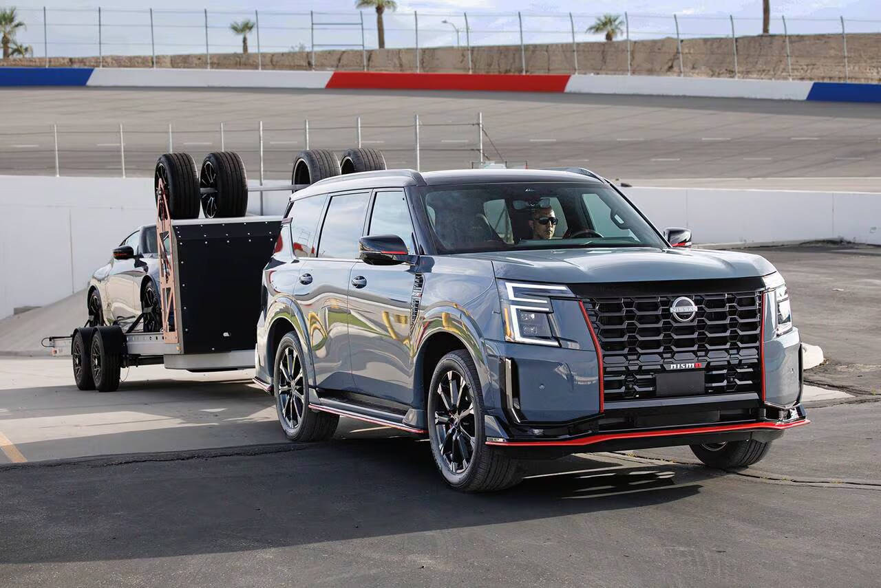 The new 2026 Nissan Armada hauling a Trailer with a car loaded on to it