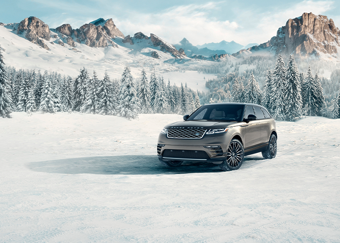 Range Rover Velar in snowy mountains