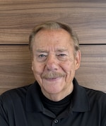 Staff member John Wakely from ID_58385f54f327