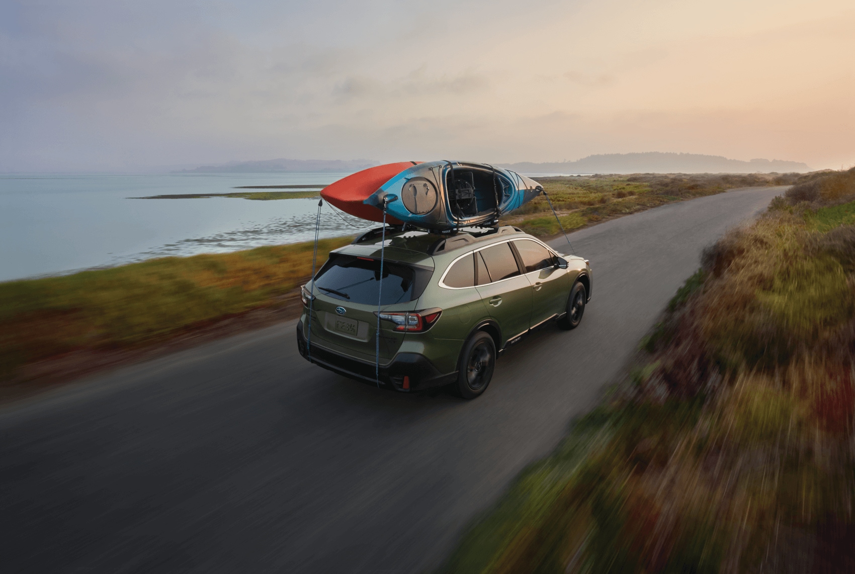 Driving a 2022 Subaru Outback at sunset