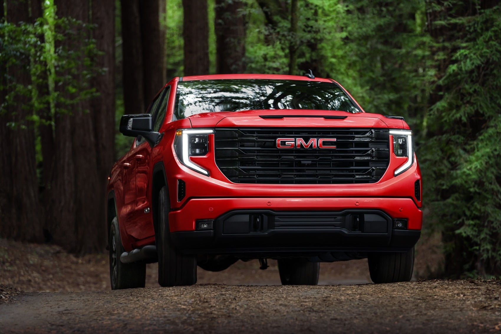 GMC Sierra 1500 front view parked in the woods