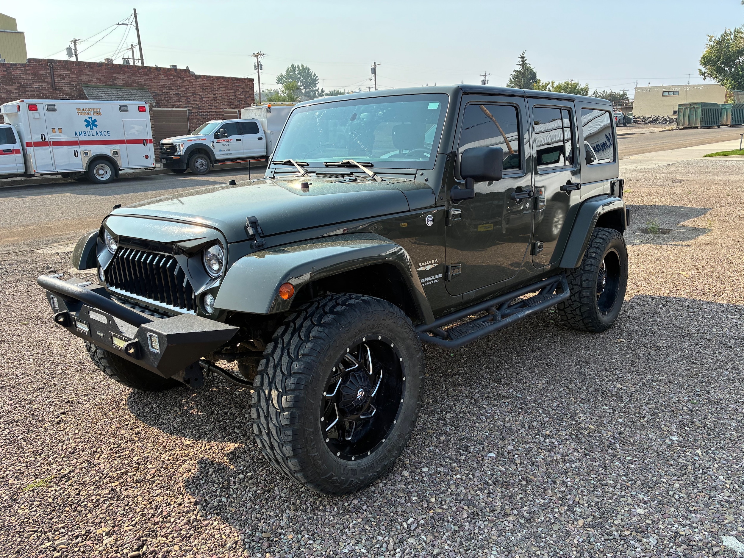 Used 2015 Jeep Wrangler Unlimited Sahara with VIN 1C4BJWEG3FL568376 for sale in Cut Bank, MT