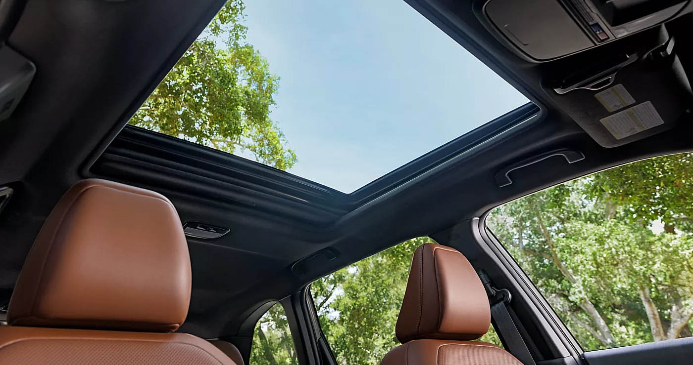 Cable-Free Experience, SUV Evolution, Cargo Space, Hands-Free Convenience, Tech-Savvy Driving, Adventure Possibilities, Safety and Style, Elevated Design, Dark Gray Finish, Machine-Finish Accents, Two-Tone Leather Trim