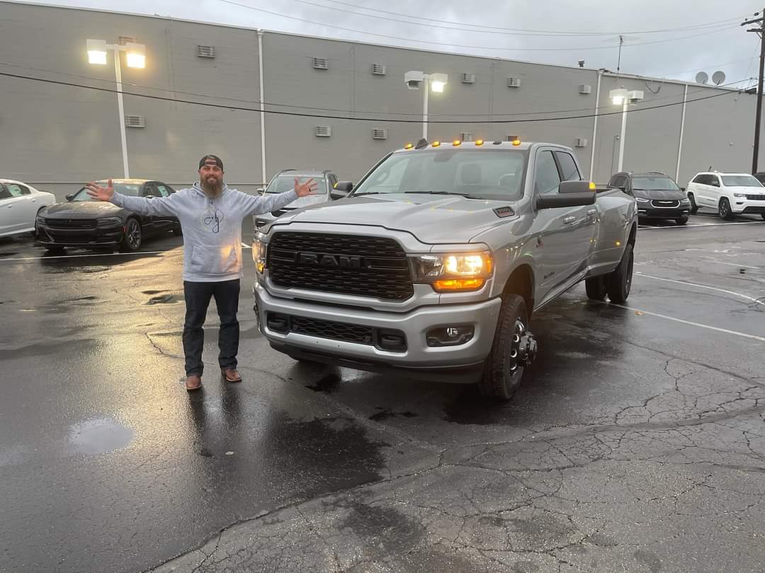 Happy man with a RAM 2500 dually he bought at Northgate CDJR