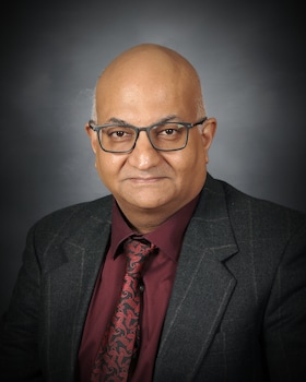 Staff member Kirit Khatri from 8fa39ff9f024