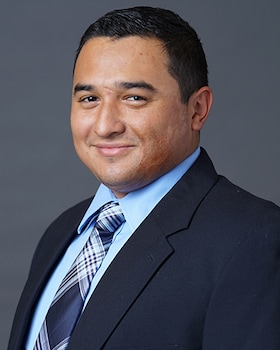 Staff member John Sanchez from 8fa39ff9f024