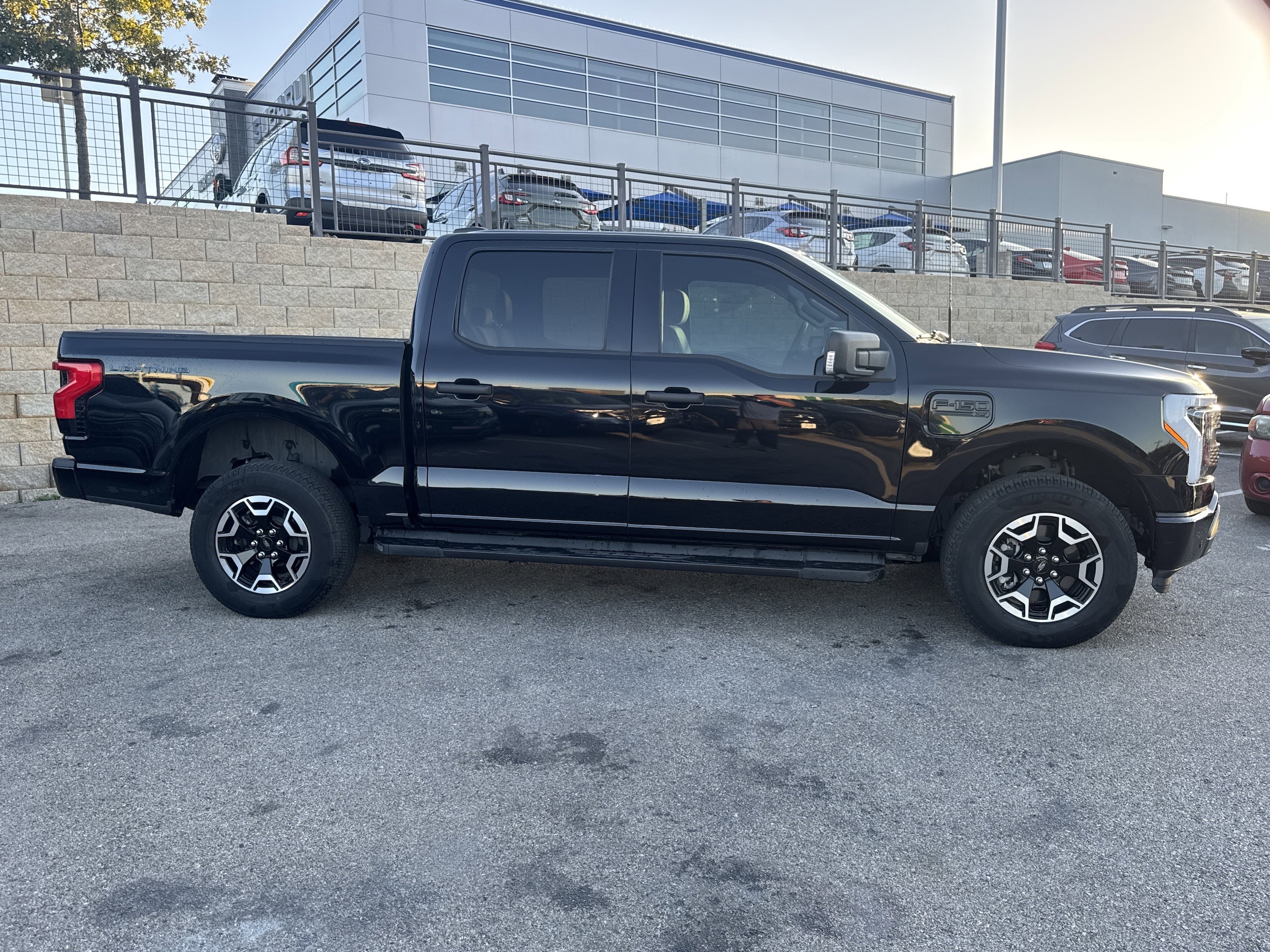 Used 2023 Ford F-150 Lightning XLT with VIN 1FTVW1EL2PWG58732 for sale in San Antonio, TX