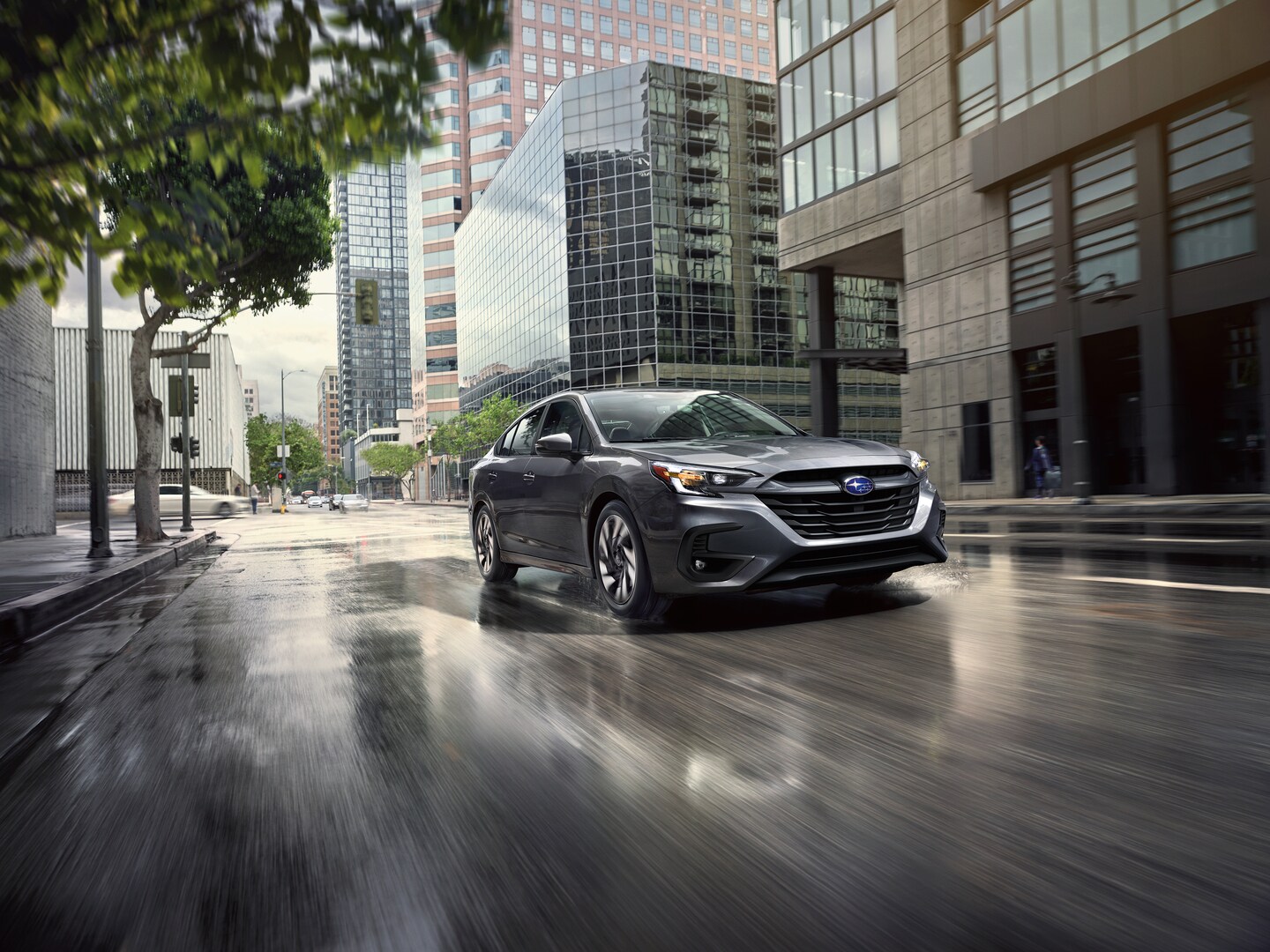 Subaru Legacy driving through city
