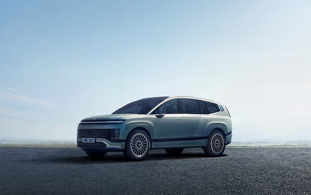  Person cheerfully signing documents.