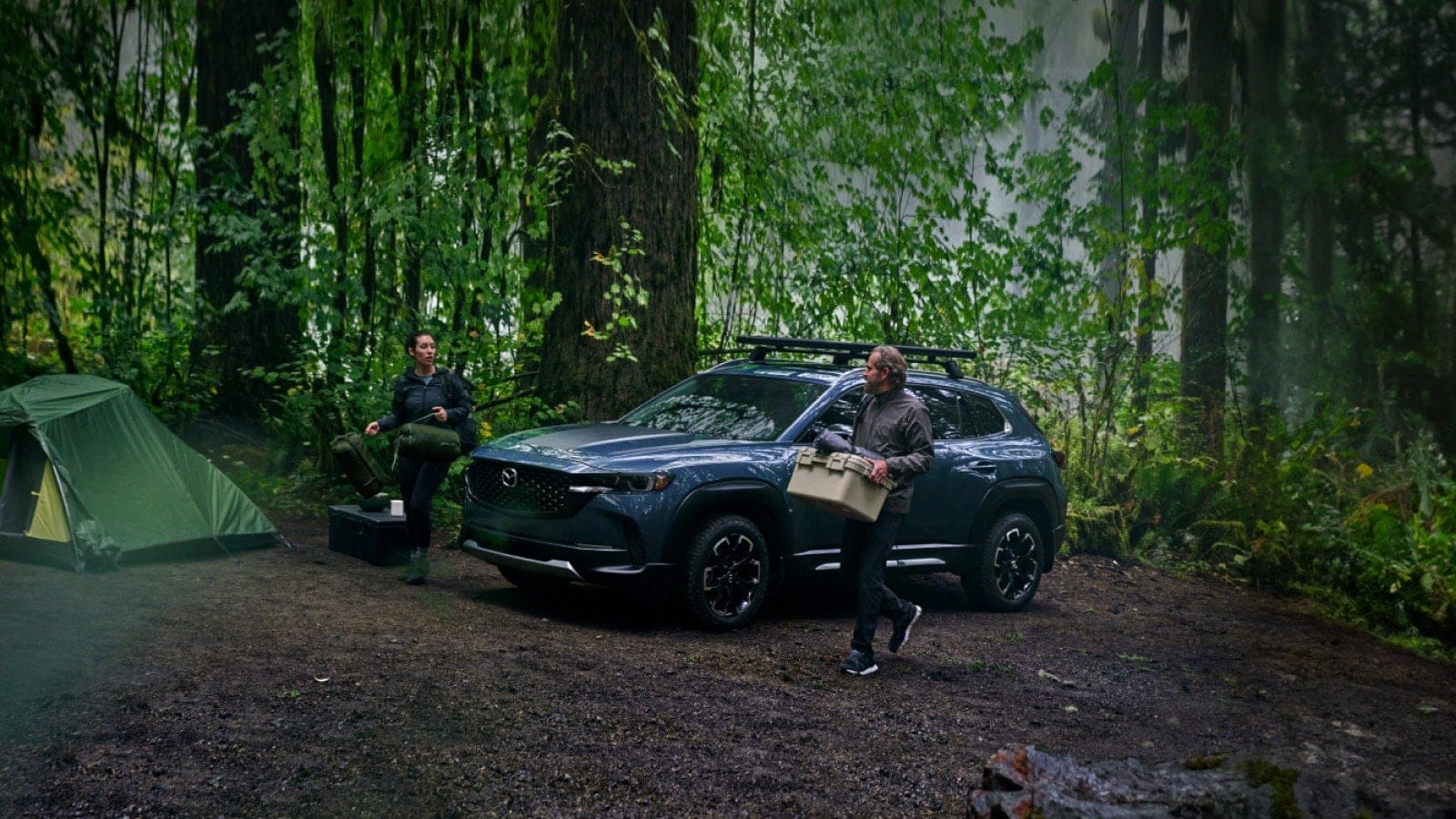 A Mazda SUV in a forest