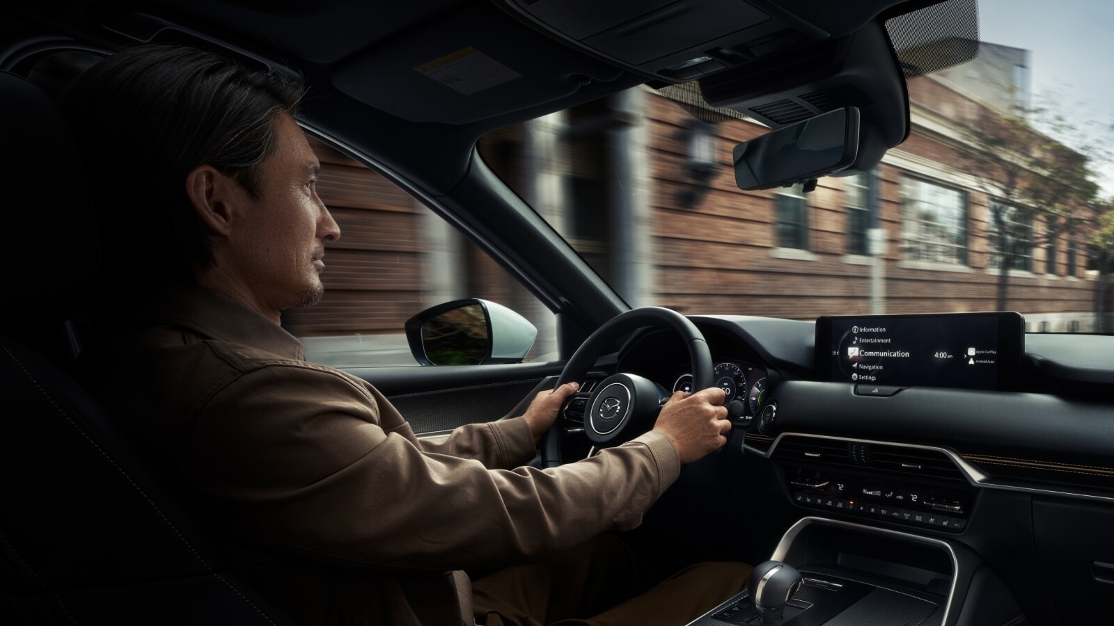 Person driving a vehicle equipped with Mazda Skyactiv-Technology