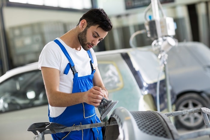 Technician working in a Mazda body shop