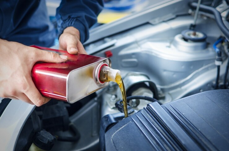 mechanic-changing-engine-oil-car-vehicle_342744-260.jpeg