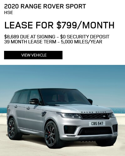 2020 RANGE ROVER SPORT HSE PARKED ON CONCRETE WITH BRIGHT BLUE CLEAR SKIES AND BRIGHT BLUE WATER IN BACKGROUND. STOCK# 20L132. $799 PER MONTH. 39 MONTH LEASE. $6,995 DOWN PAYMENT. VIEW VEHICLE.