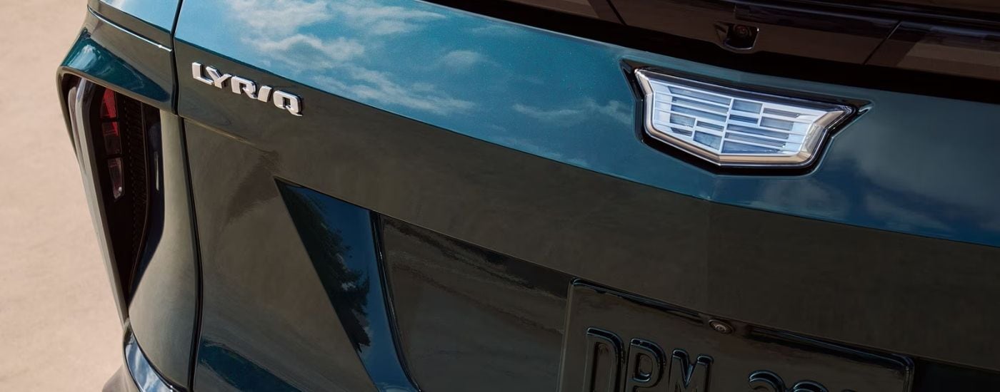 Rear badge and bumper on a green 2025 Cadillac LYRIQ