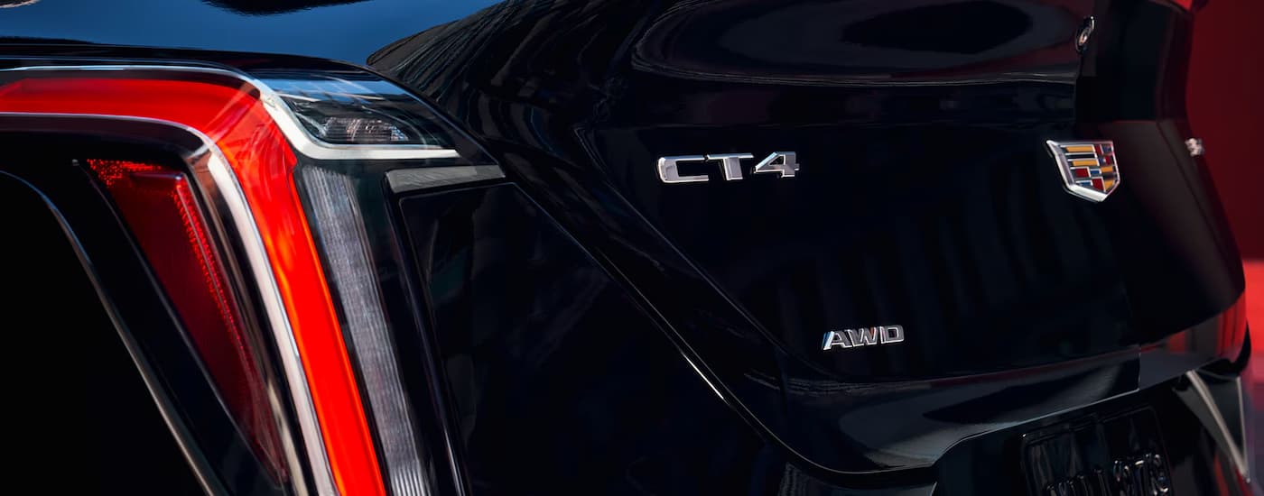 Close up of the rear of a black 2025 Cadillac CT4 at a Cadillac dealer near Miami Gardens