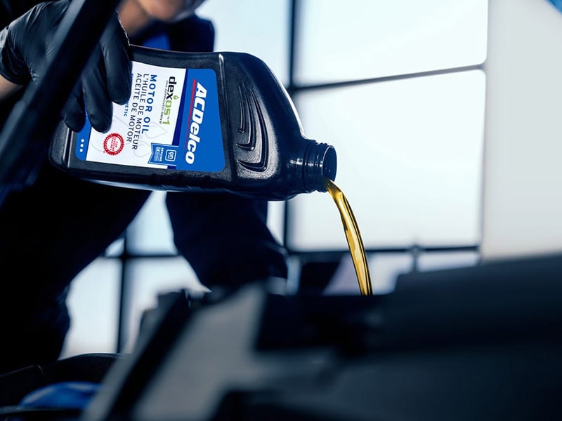 ACDelco GM OE dexos 1 full synthetic motor oil being poured during a Cadillac oil change at Ocean Cadillac